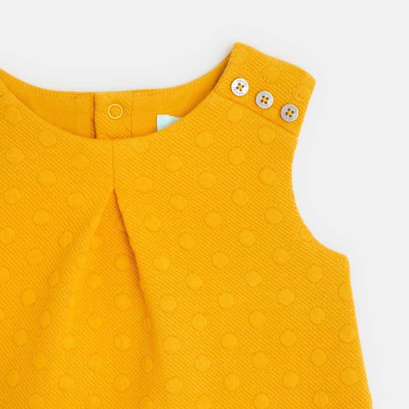 Robe chasuble gaufrée effet pois jaune bébé fille