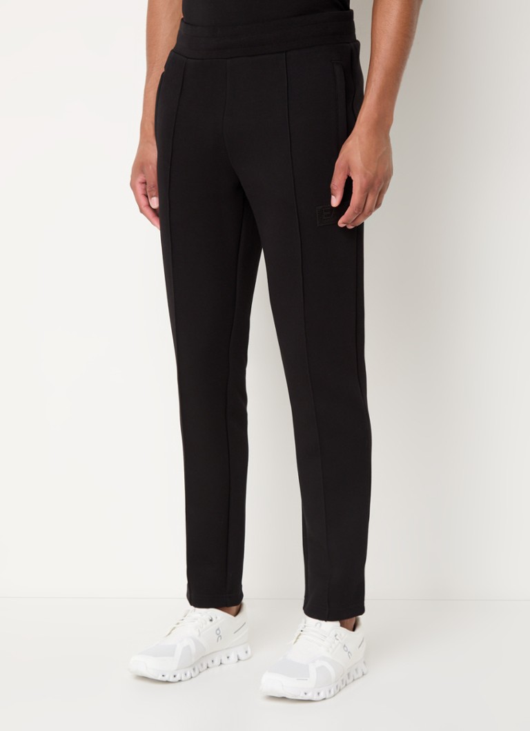 Pantaloni de trening slim fit de la Emporio Armani, cu logo și buzunare laterale.