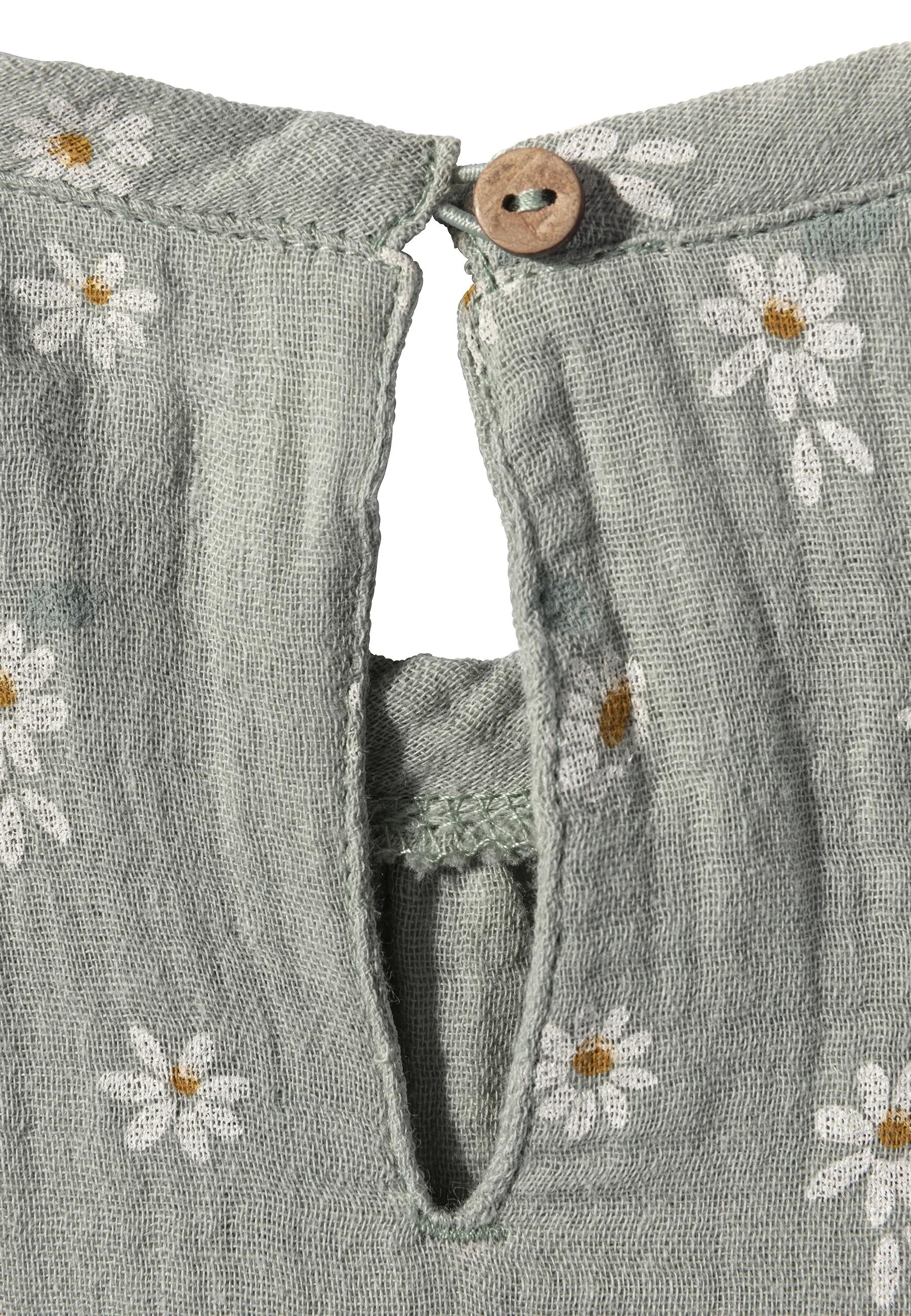 Babykleid bedruckt mit Gänseblümchen in versch. Farben