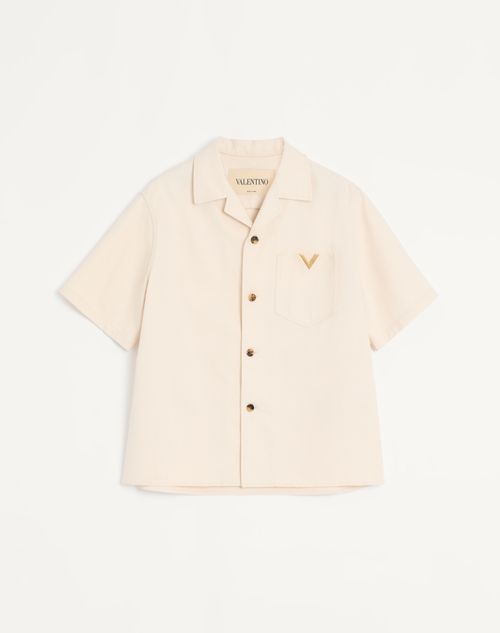 Camisa de boliche Valentino em jeans com detalhes dourados