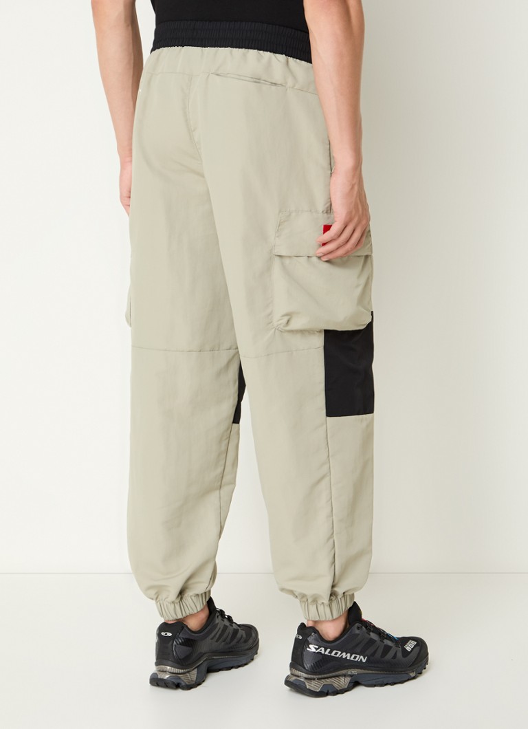 The North Face Tapered fit track pants with flap pockets and logo