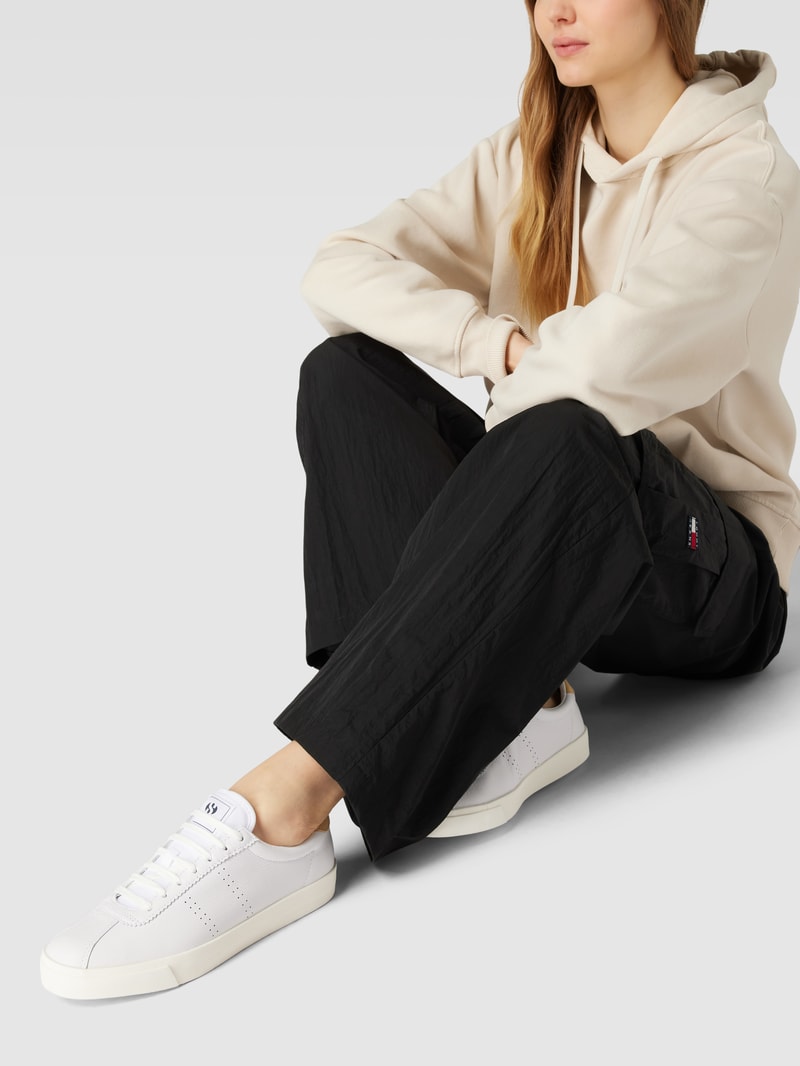 Sneaker mit Label-Details in hellgelb