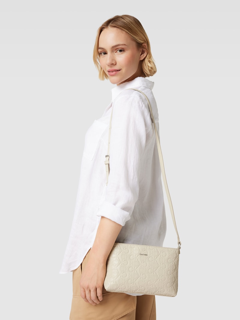 Umhängetasche mit Label-Print Modell 'MUST' in beige