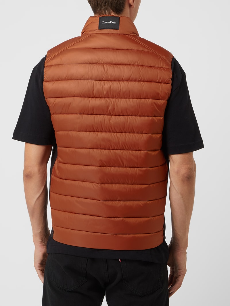 Light-Steppweste mit Stehkragen in dunkel orange