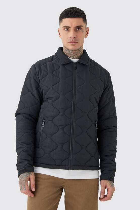 Tall schwarze gesteppte Jacke mit Kragen