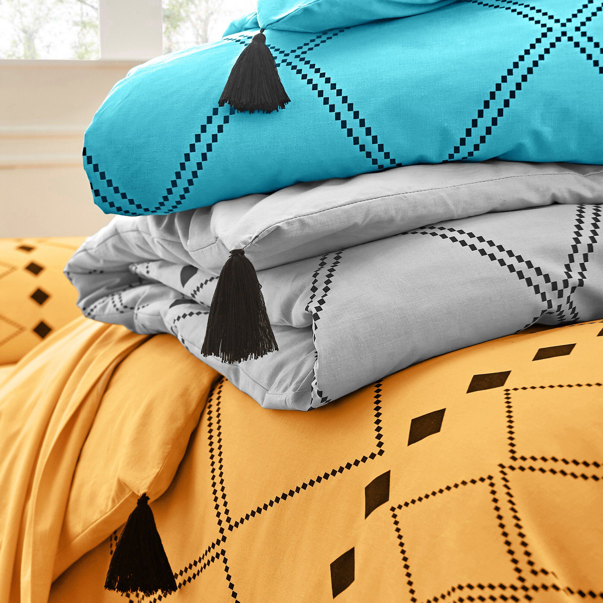 Linge de lit Massaï coton à motifs graphiques et finitions pompons