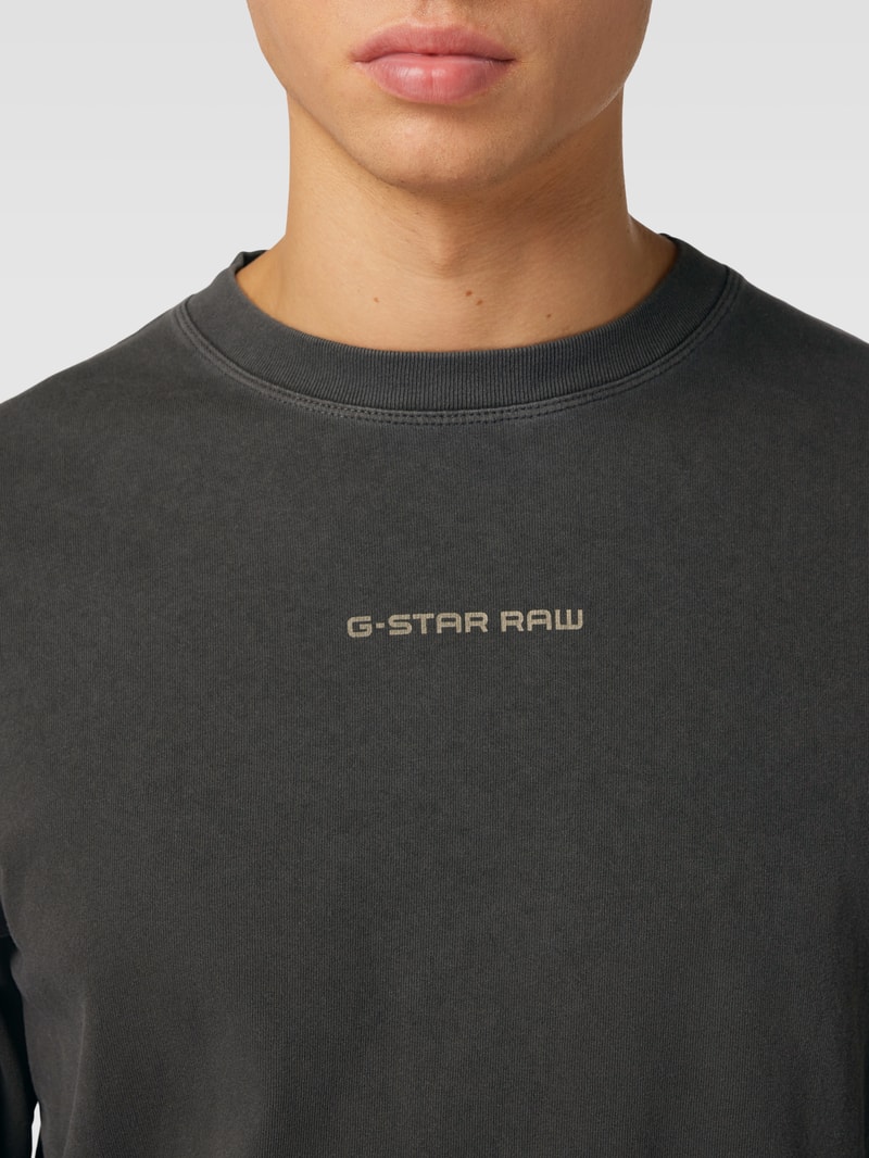 Sweatshirt in unifarbenem Design mit Label-Print in schwarz