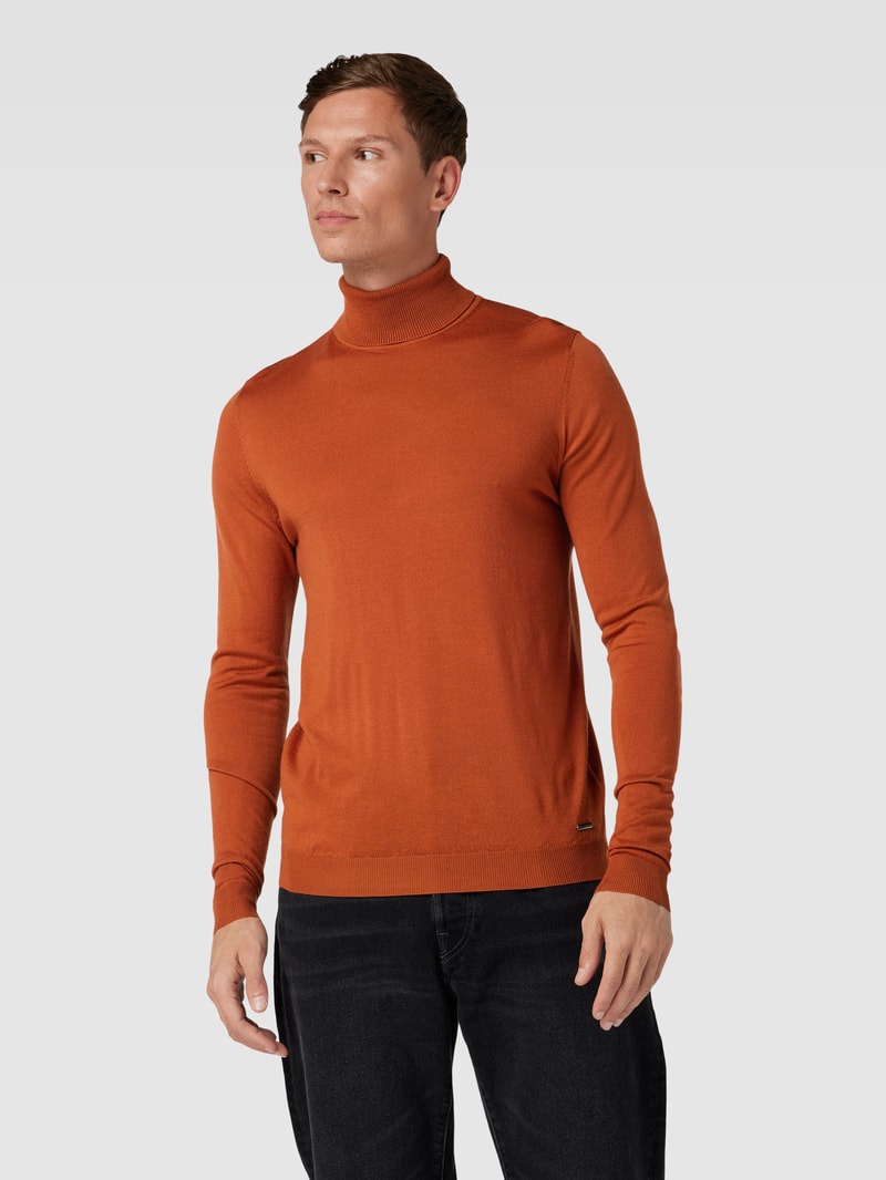 Rollkragenpullover aus Schurwolle mit gerippten Abschlüssen in orange