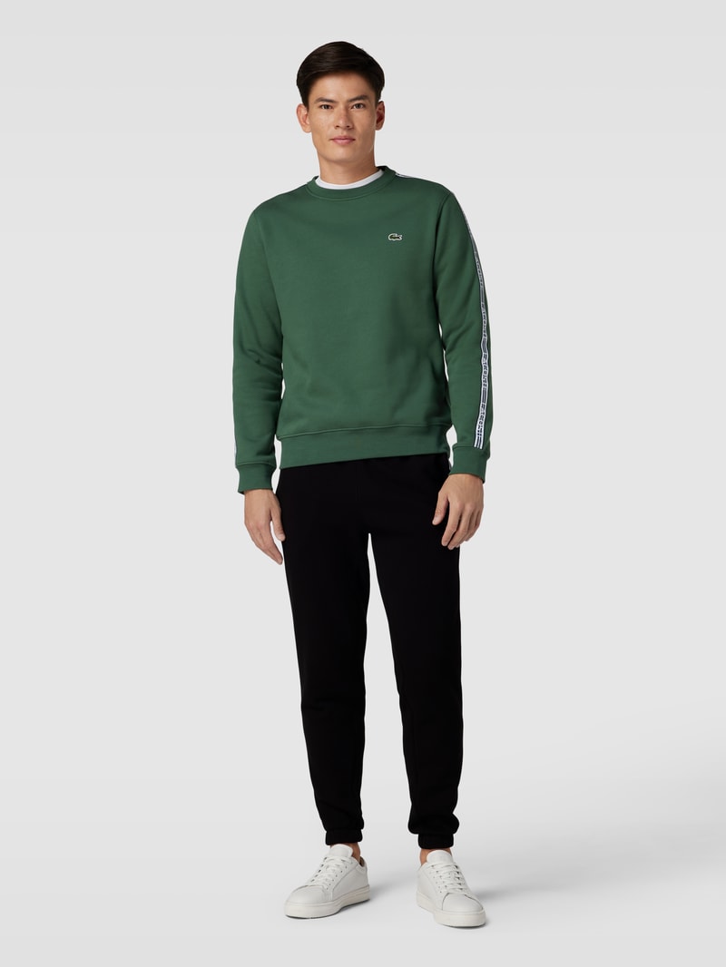 Sweatpants mit Label-Streifen Modell 'TAPE' in schwarz