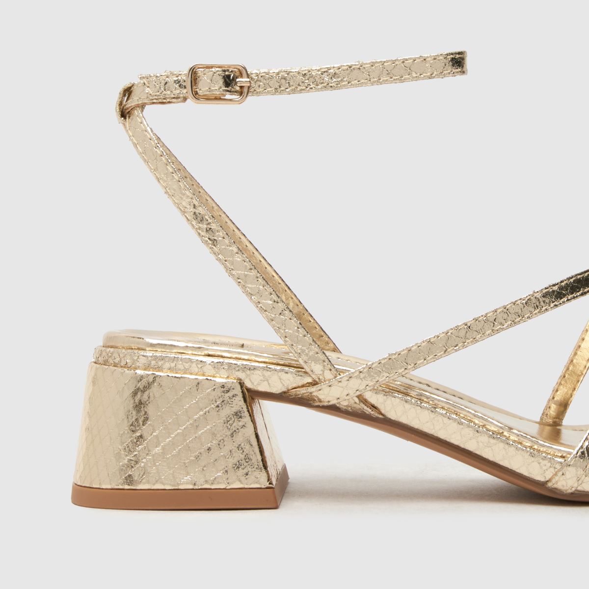 Schuh Sander – Guldfärgade sandaler med remmar