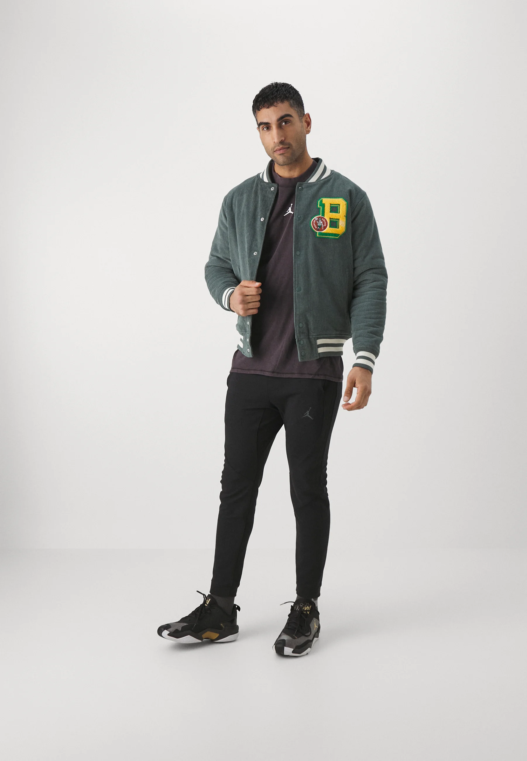 Chaqueta universitaria universitaria de la NBA Mitchell & Ness - Equipo