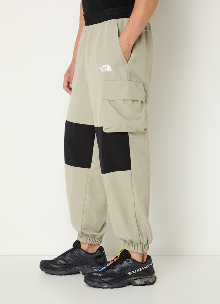 The North Face Tapered fit track pants with flap pockets and logo