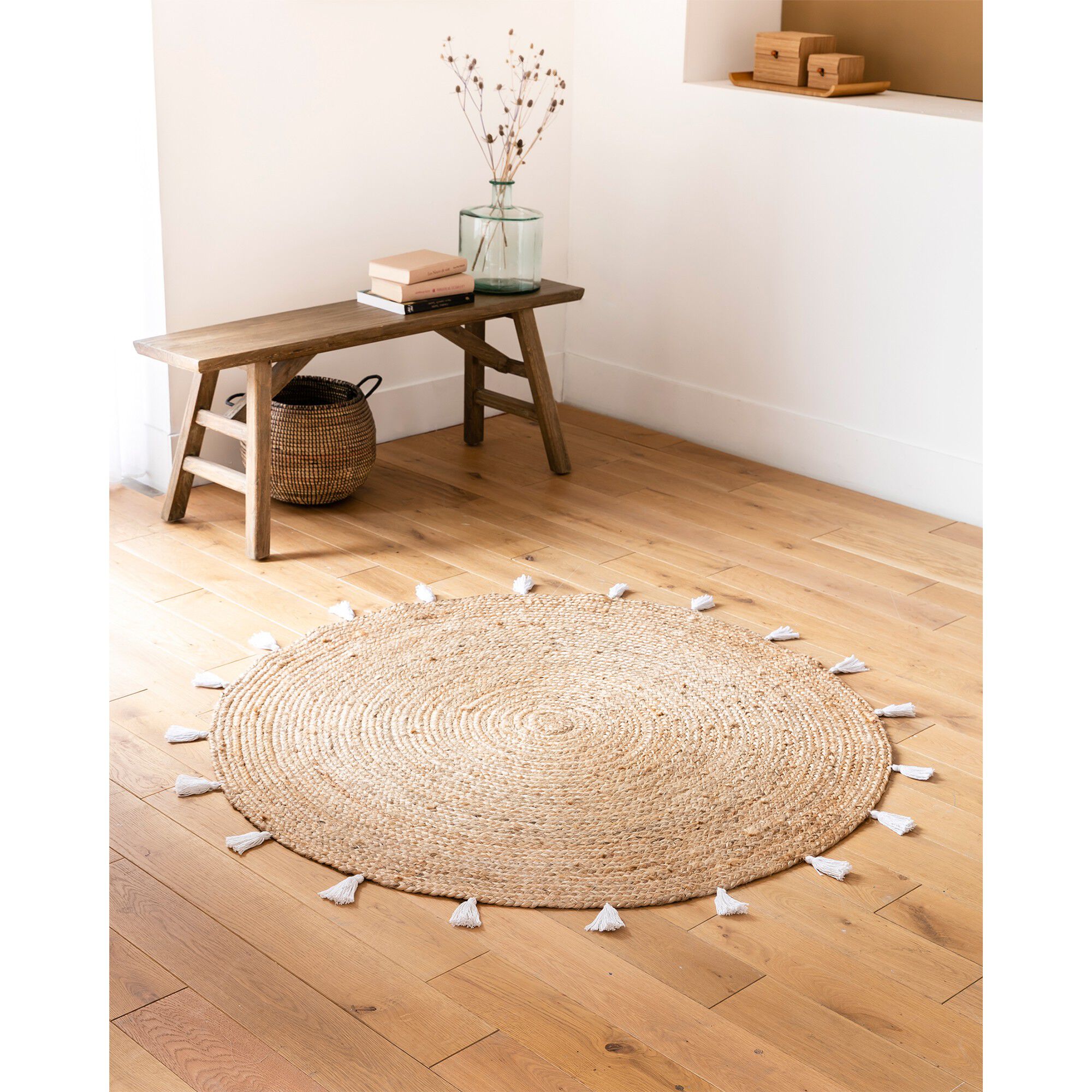 Tapis rond en jute avec pompons de couleur