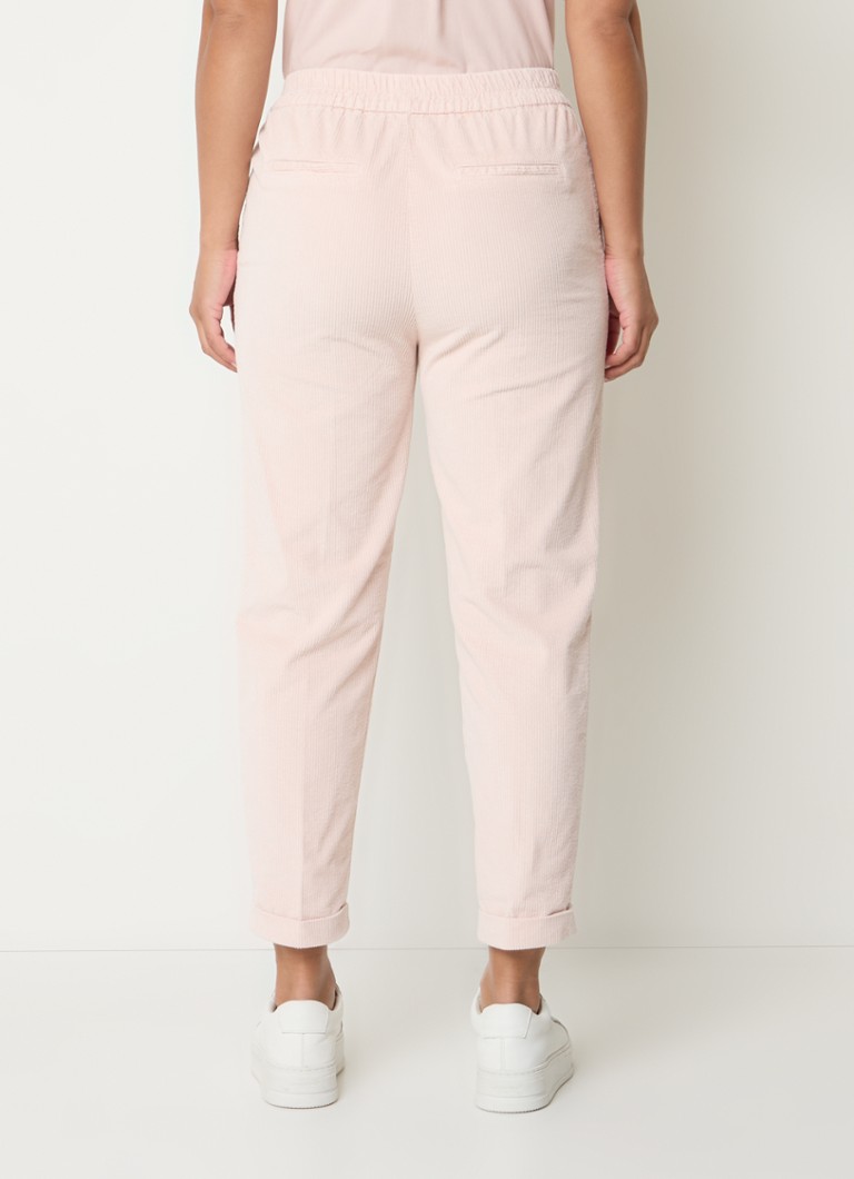 Pantaloni mulați din catifea reiată, cu talie înaltă și croială scurtă pe picior, de la Benetton.