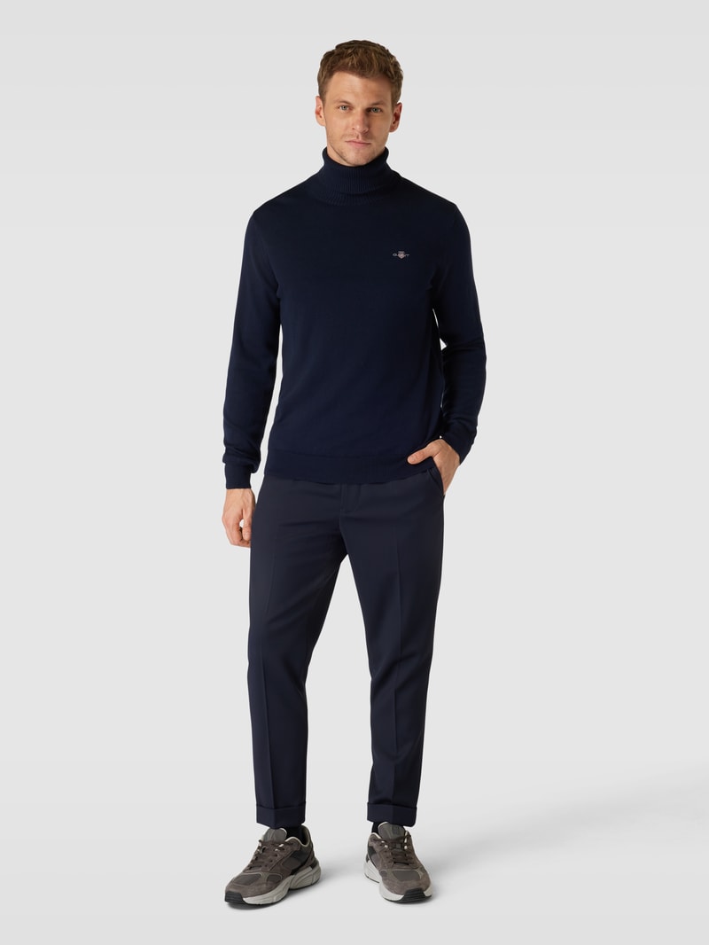 Rollkragenpullover mit Label-Stitching aus Baumwoll-Woll-Mix in marineblau