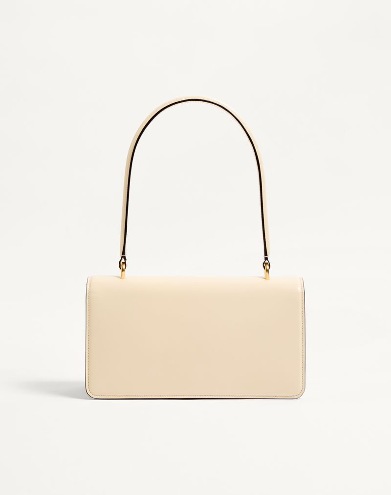 Bolsa Valentino Garavani Vain em couro de bezerro brilhante com alça.