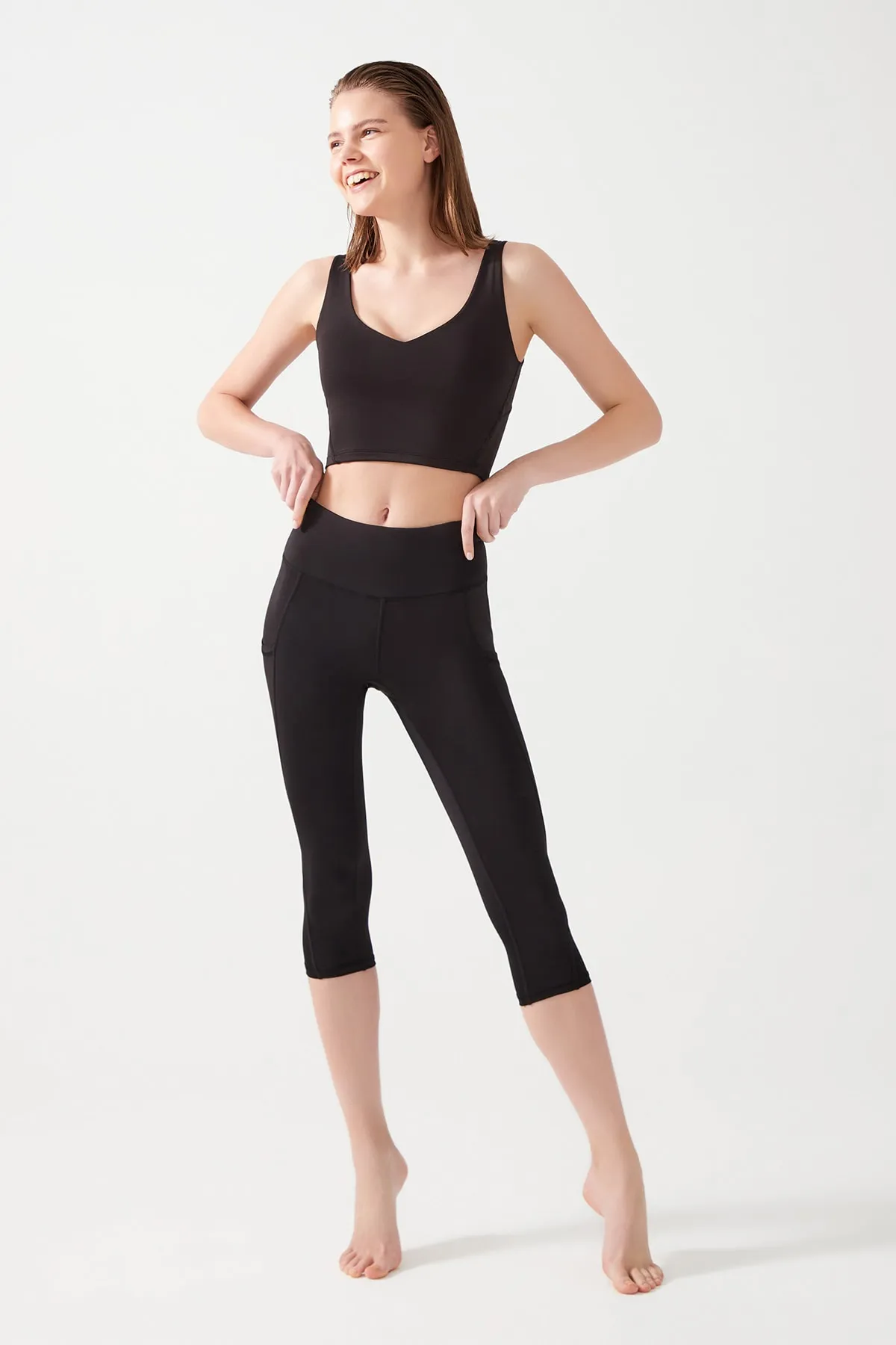LOS OJOS  Schwarze Damen-Capri-Leggings mit hoher Taille und doppelter Tasche unterhalb des Knies