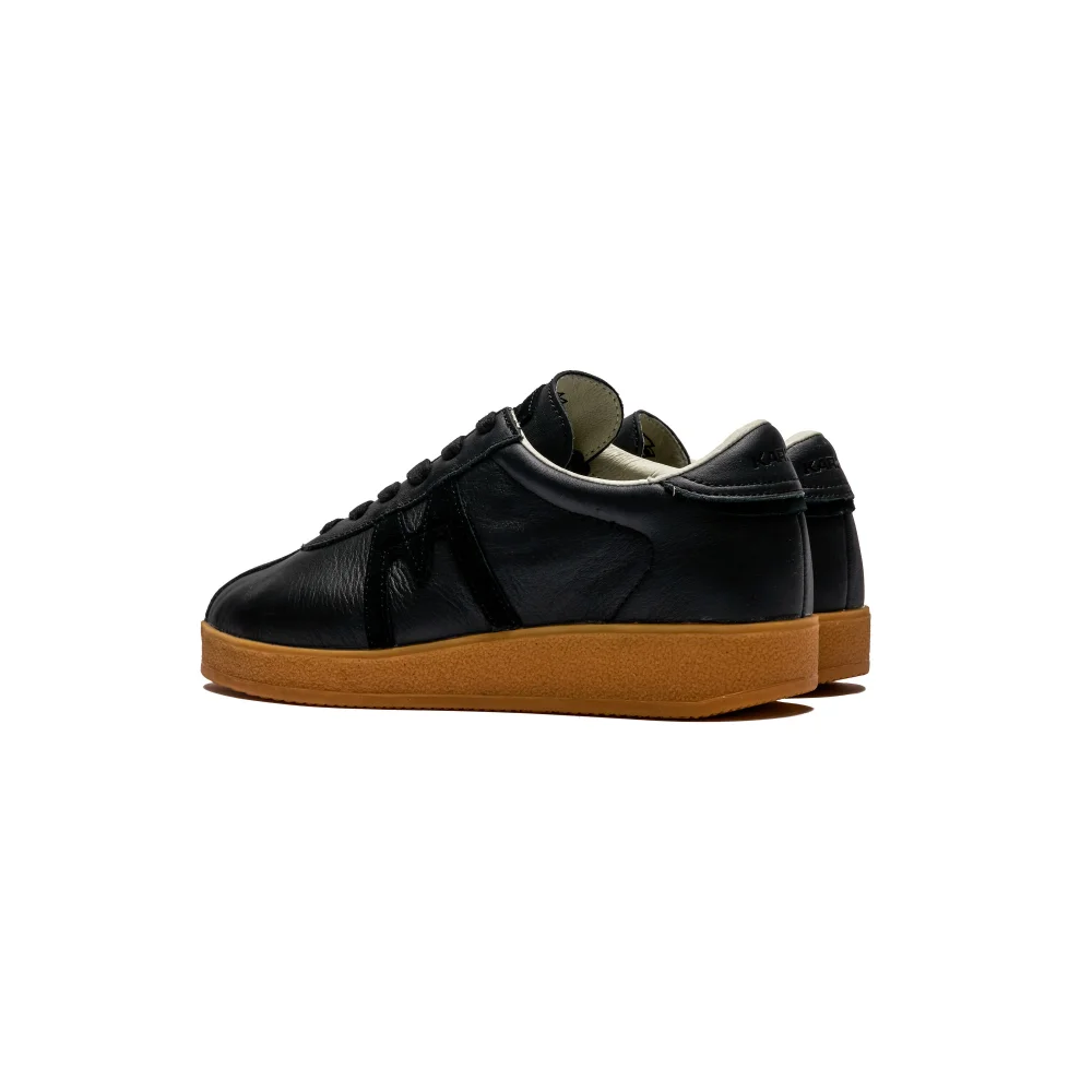 Karhu Trampas F809036 / schwarz