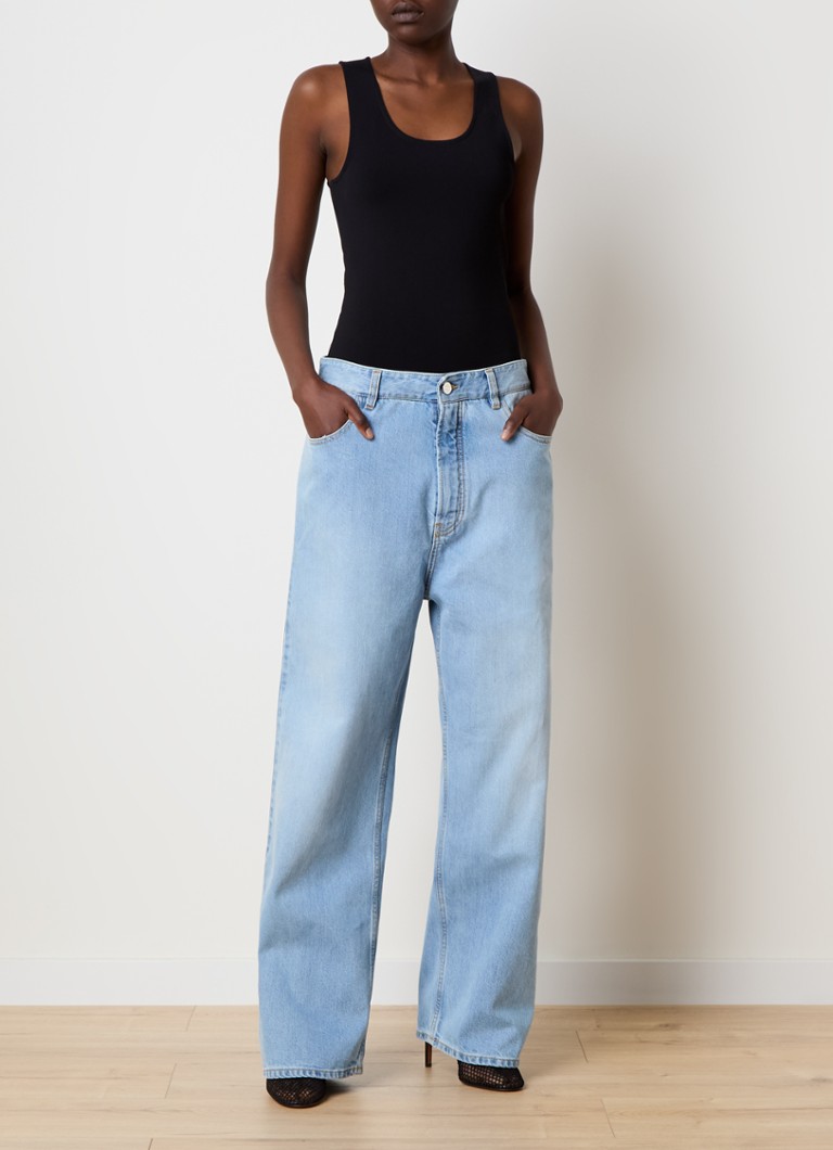 Alaïa light wash denim jumpsuit