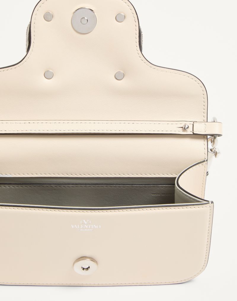 Bolsa de ombro pequena Valentino Garavani Locò com logotipo de joia