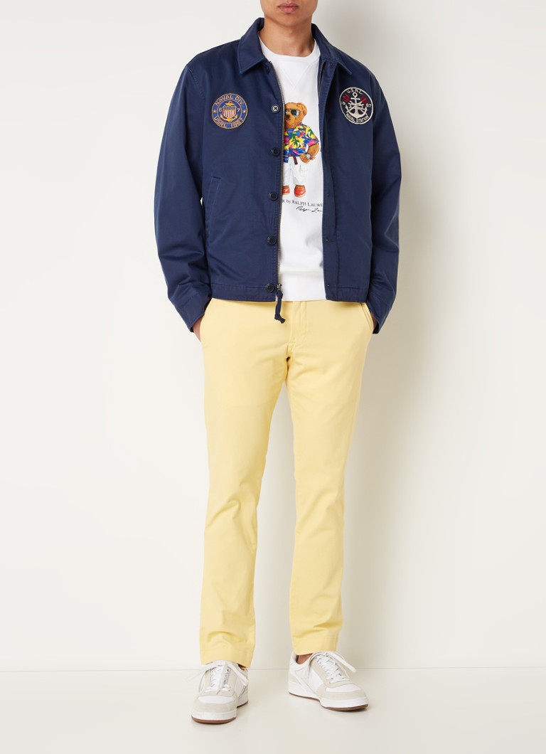 Jaqueta Ralph Lauren com bordados e bolsos laterais.