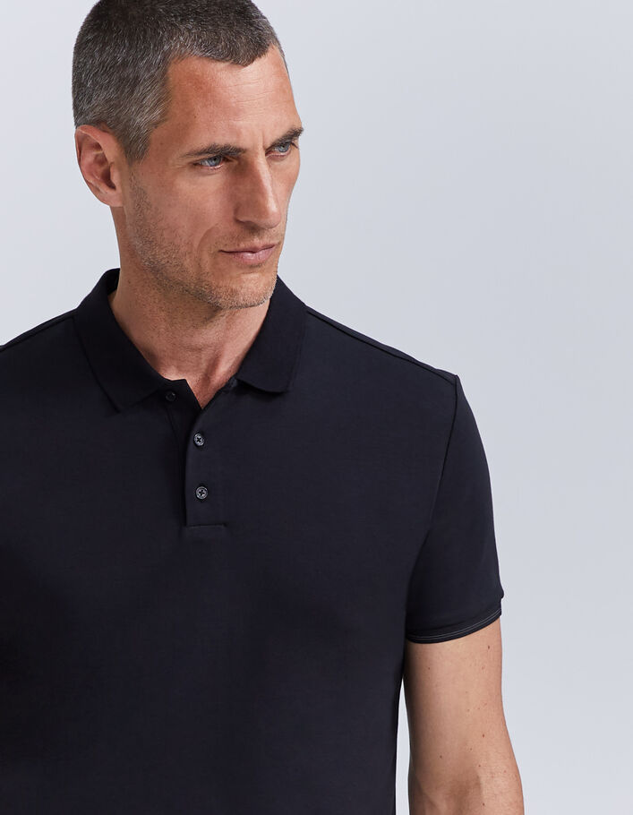Polo noir DRY FAST élastique rayé aux manches Homme