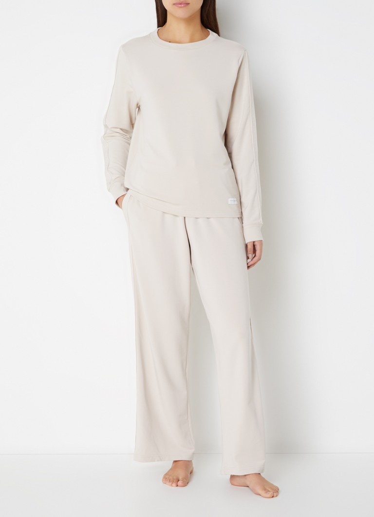 Pantaloni de trening Tommy Hilfiger cu croială lejeră, talie înaltă și bandă cu logo în talie.