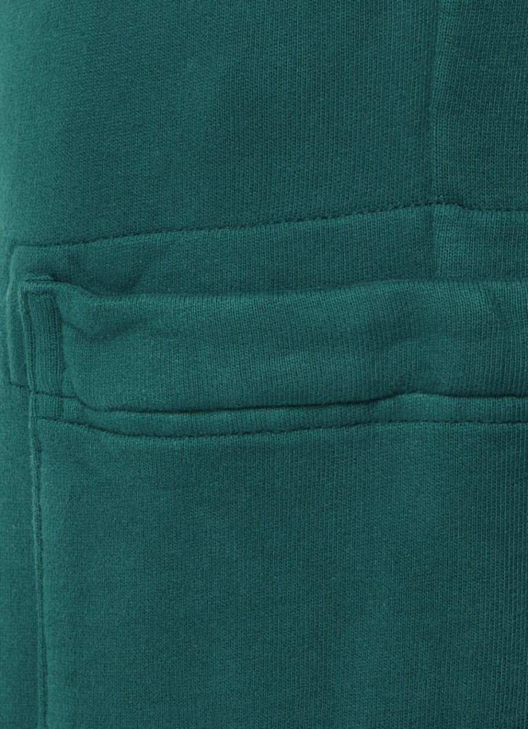 Stone Island 62620 sašaurinātas sporta bikses ar sānu kabatām un logotipu