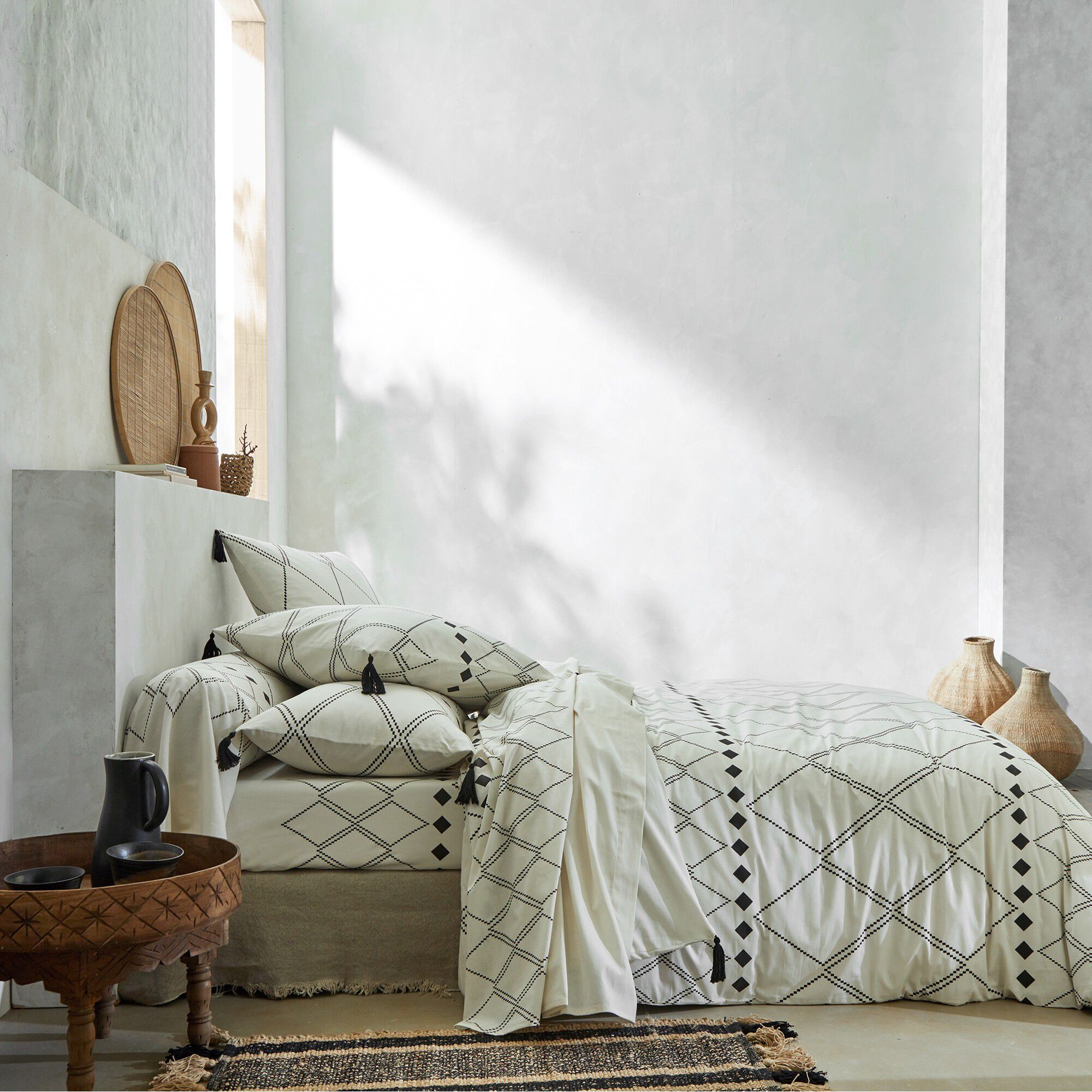 Linge de lit Massaï coton à motifs graphiques et finitions pompons