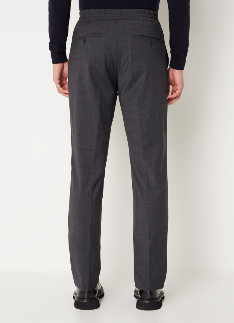 Pantaloni chino Sandro din amestec de lână, cu croială mulată și buzunare laterale.