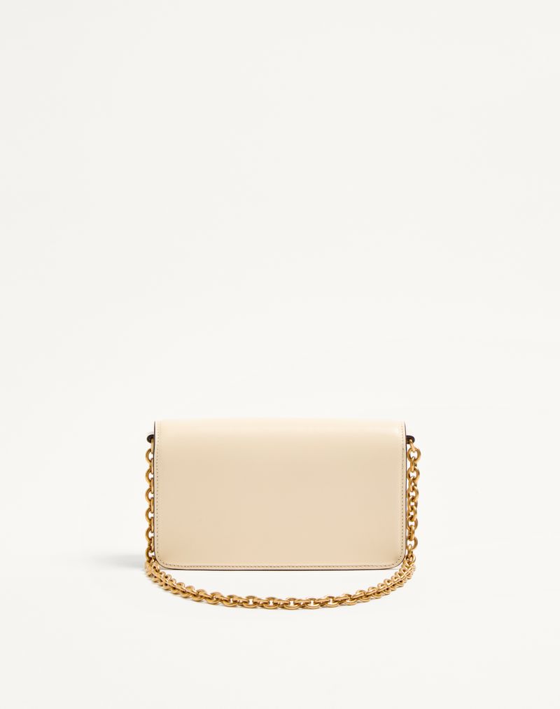 Clutch Vain da Valentino Garavani em couro de bezerro brilhante