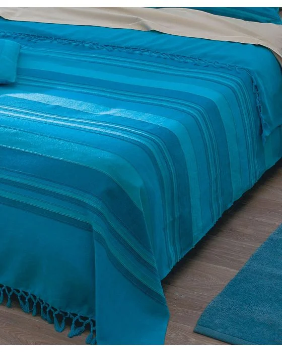 Jeté de fauteuil ou de canapé uni et rayé