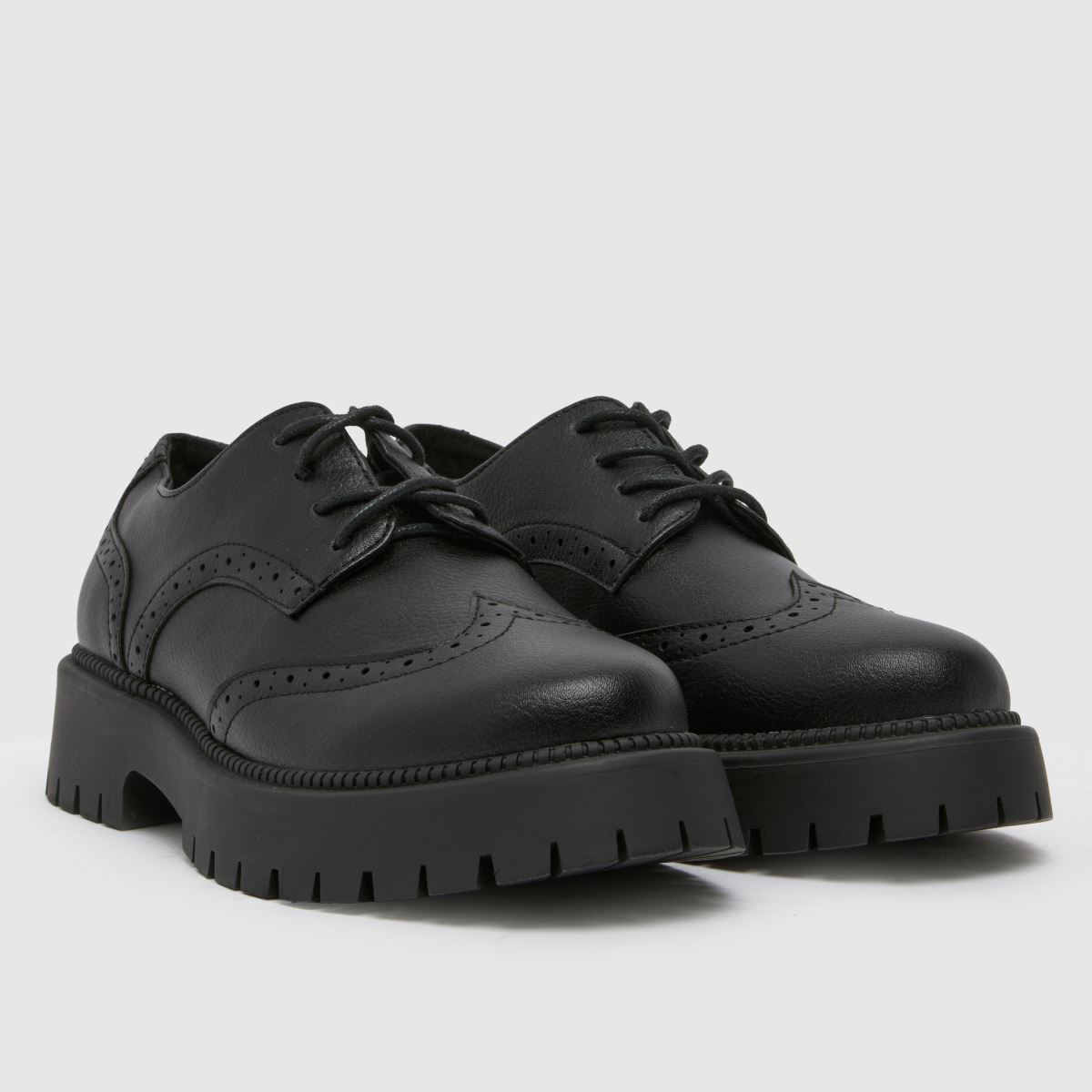 Schuh Wide Fit Lesley brogue fűzős lapos talpú cipő fekete színben