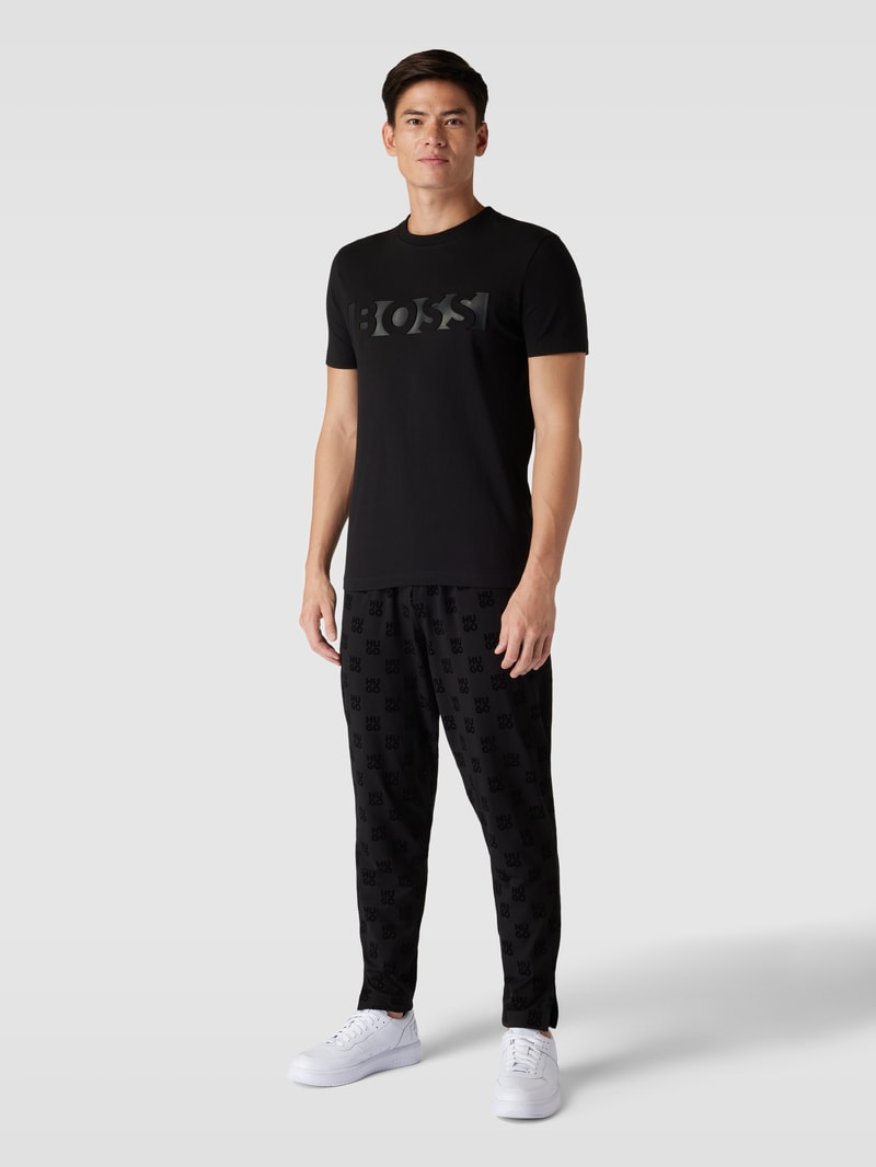 Sweatpants mit Allover-Logo-Muster Modell 'Flock' in schwarz