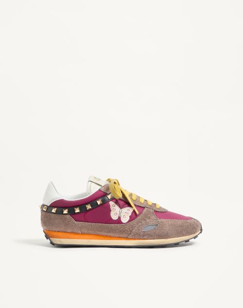 Baskets cloutées en cuir fendu et nylon avec broderie papillon