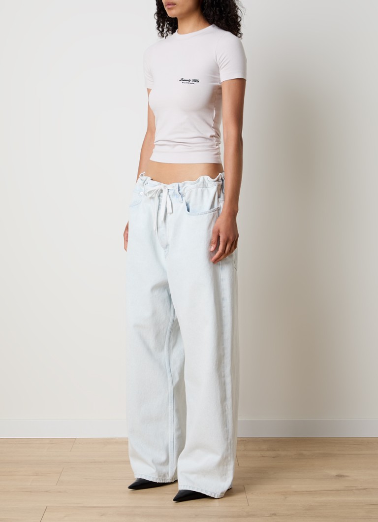Jeans Balenciaga a vita bassa e gamba larga, lavaggio chiaro.