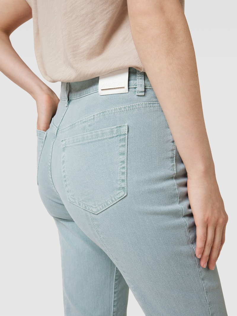 Bootcut Jeans mit ausgefransten Abschlüssen in petrol