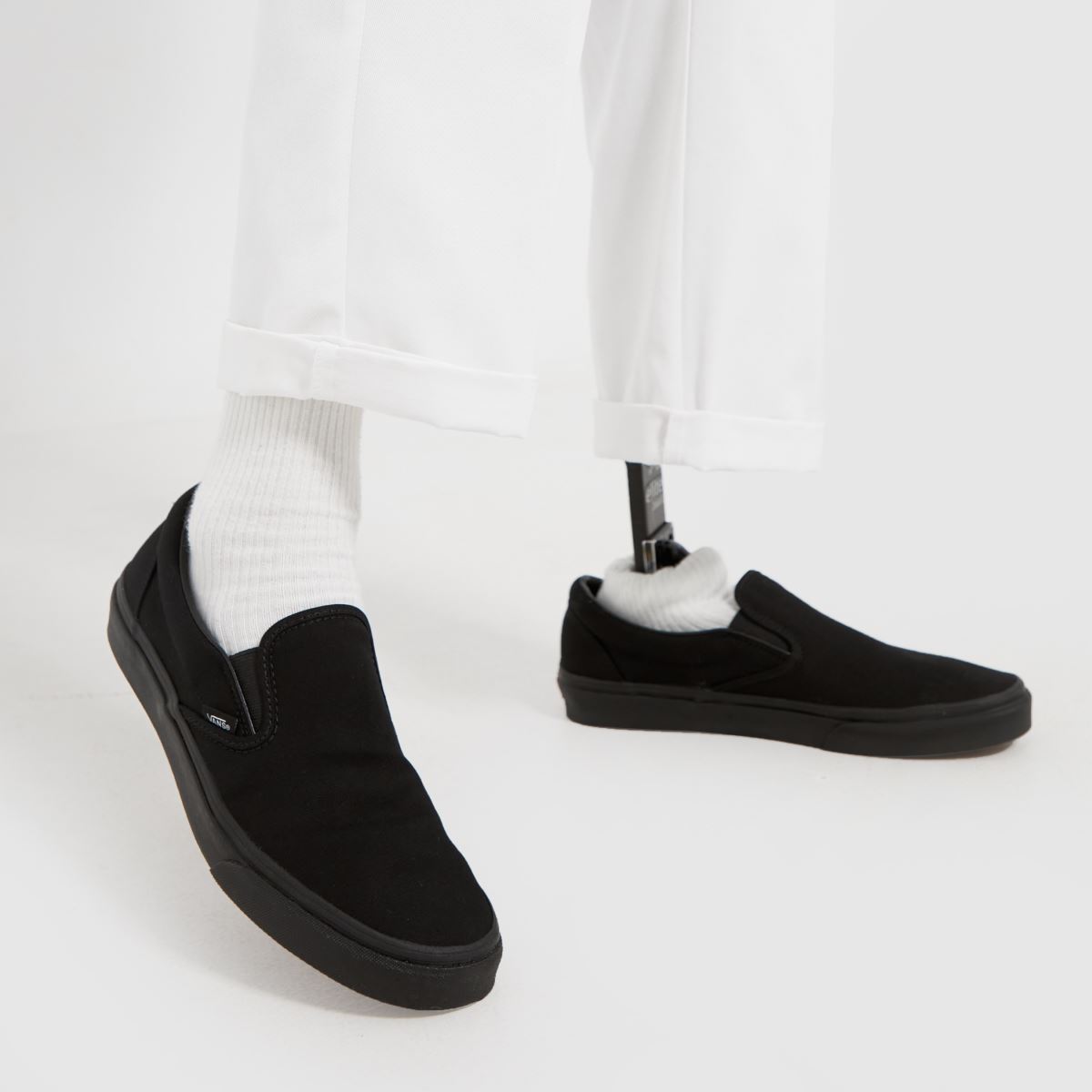 Vans – Klassiska slip-on-sneakers i svart