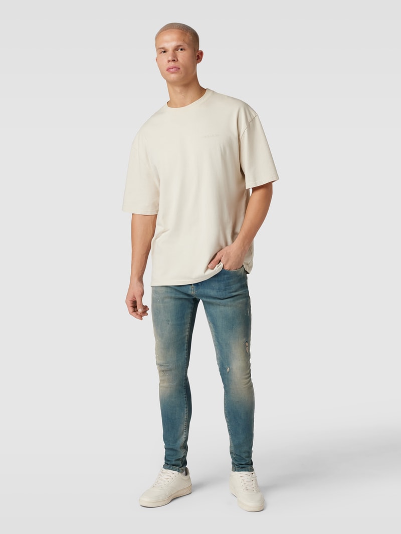 Tapered Fit Jeans im Destroyed-Look Modell 'Noel' in hellblau
