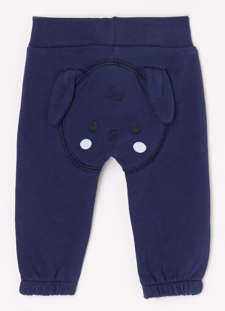 Pantaloni de trening Benetton cu croială conică și broderie.