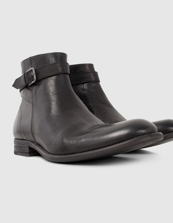 Boots noires en cuir avec bride à boucle Homme