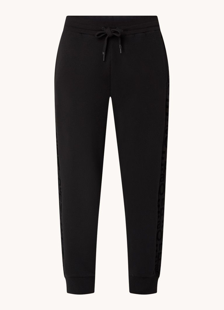 Pantaloni de trening cu talie înaltă și model conic pe picioare, decorați cu sigla Emporio Armani.