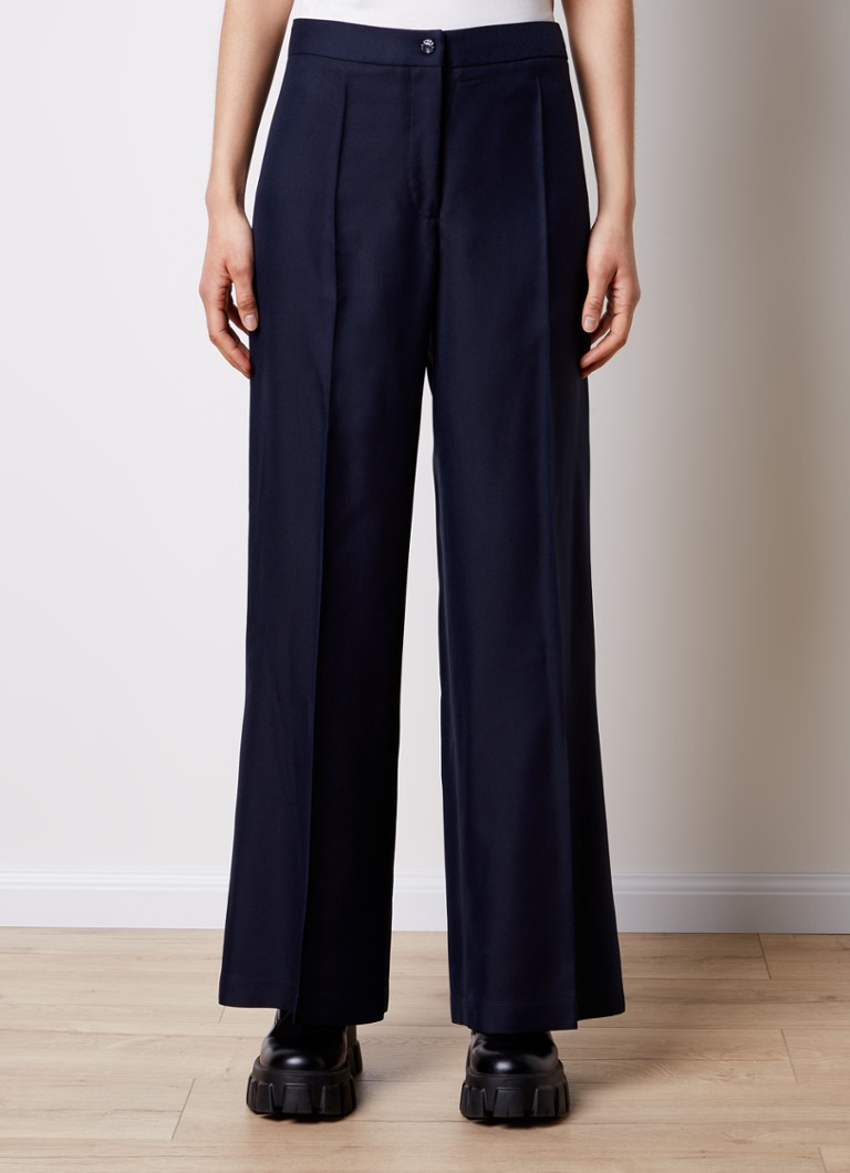 Pantaloni Moncler cu talie înaltă, croială largă și detalii plisate.