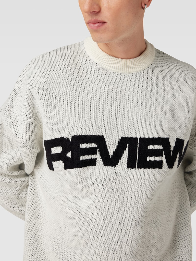 Strickpullover mit Label-Details in ecru
