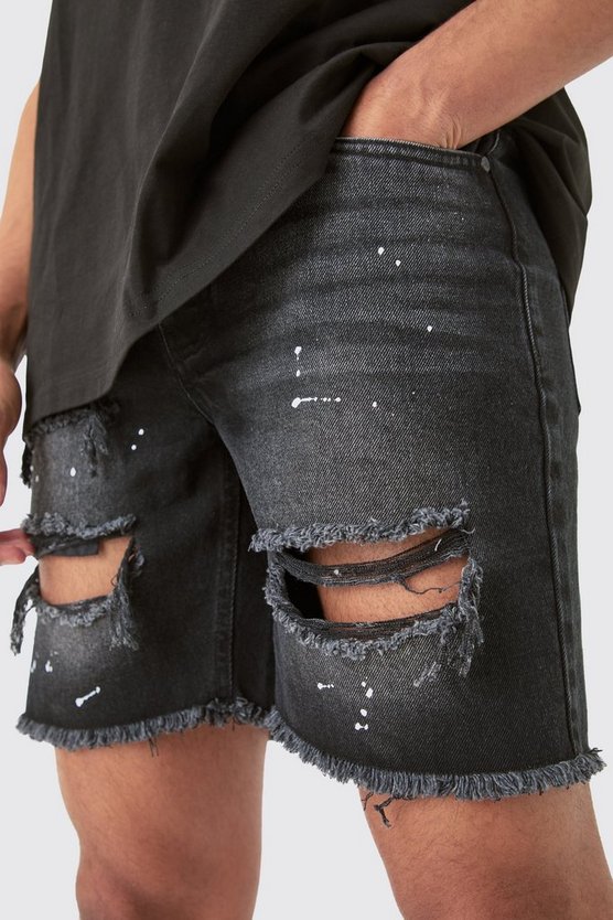 Schwarze Slim-Fit Jeansshorts mit Rissen und Farbspritzern