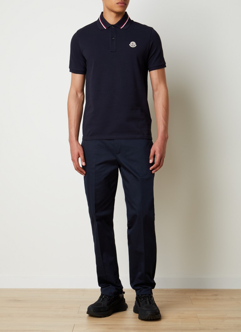Tricou polo Moncler cu croială clasică, manșete contrastante și logo.