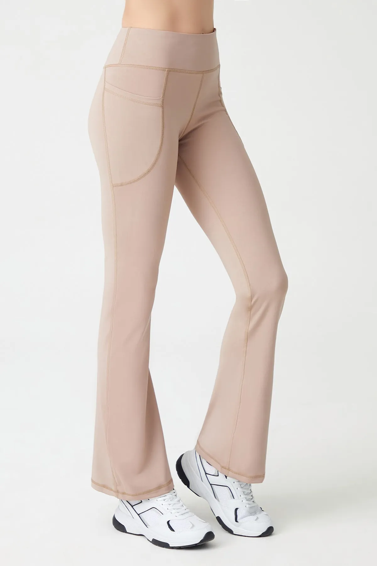 LOS OJOS  Beigefarbene, glättende Bootcut-Strumpfhose mit hoher Taille und ausgestelltem Bein und doppelter Tasche