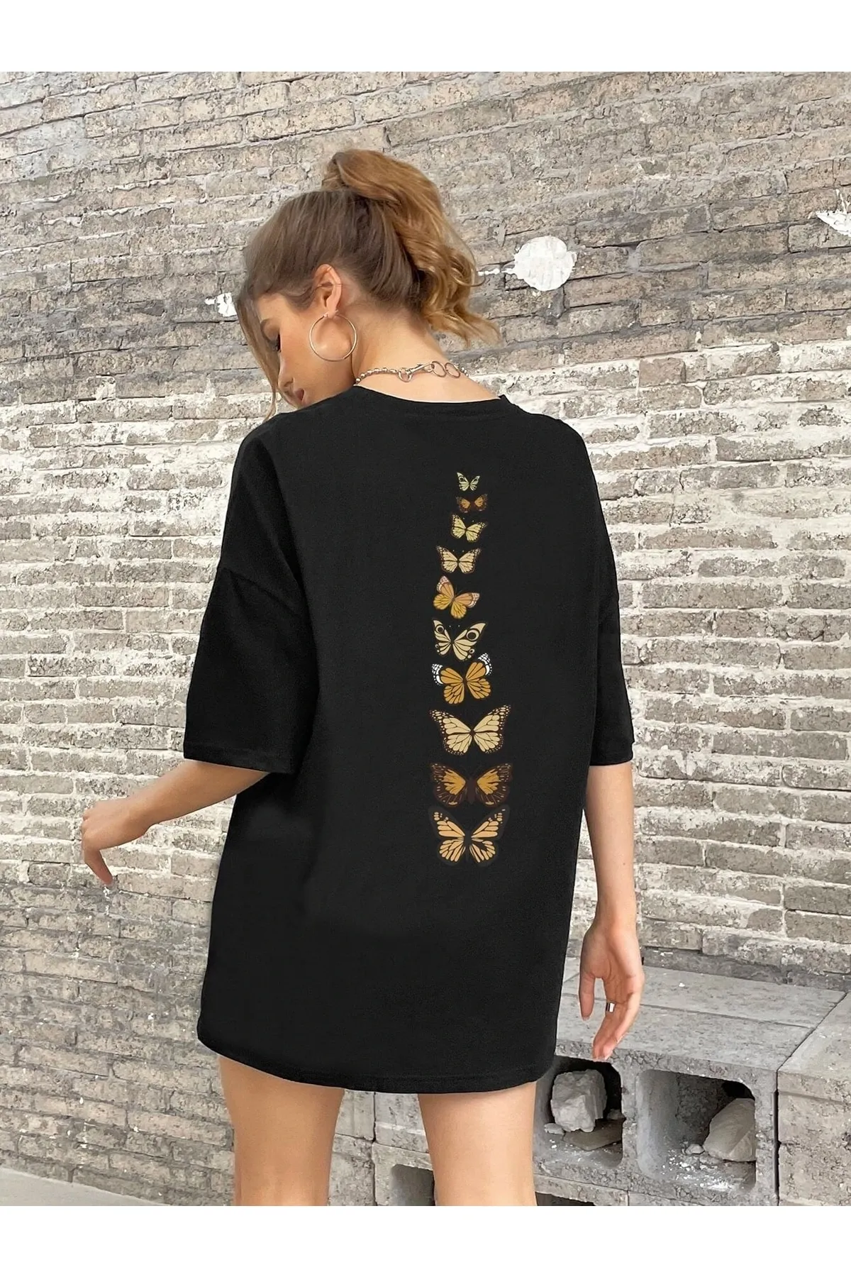 Know  Schwarzes Oversize-T-Shirt mit vertikalen Schmetterlingen für Damen