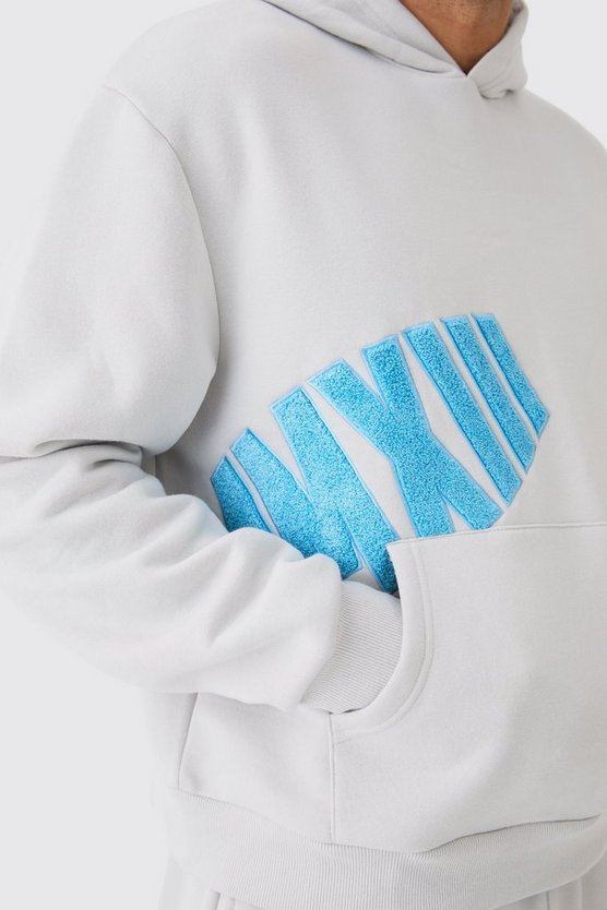Kastiger Oversize Hoodie mit Borg-Applikation