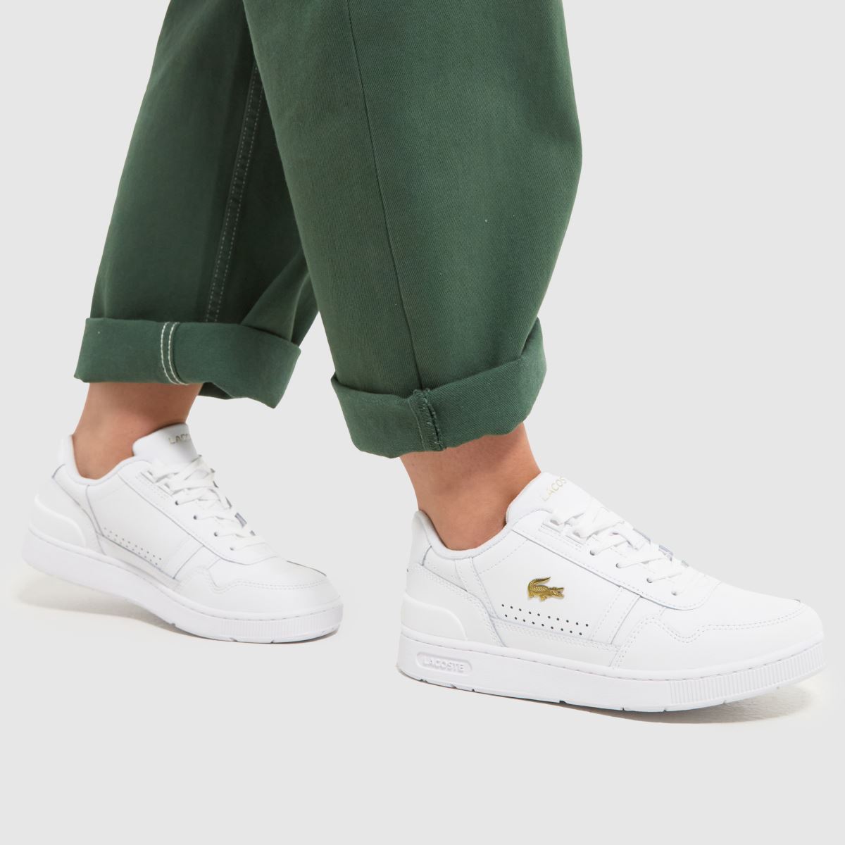 Lacoste T-clips-sneakers i vitt och guld